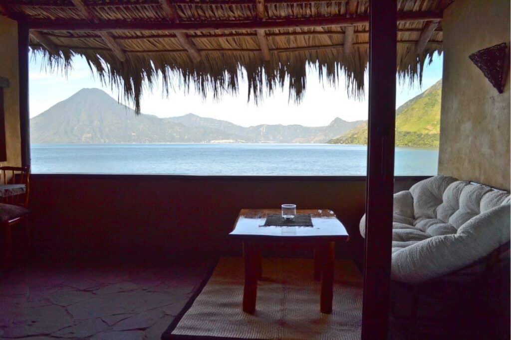 View of Lake Atitlan and a volcano peak from the terrace at Laguna Lodge