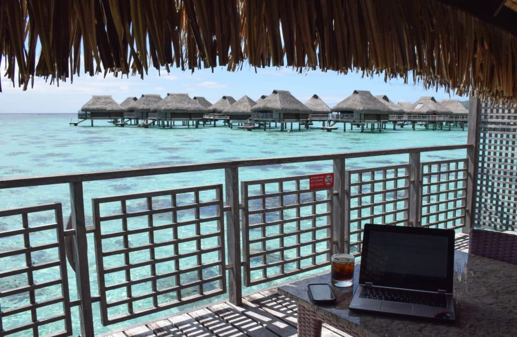 Laptop in overwater bungalow Tahiti