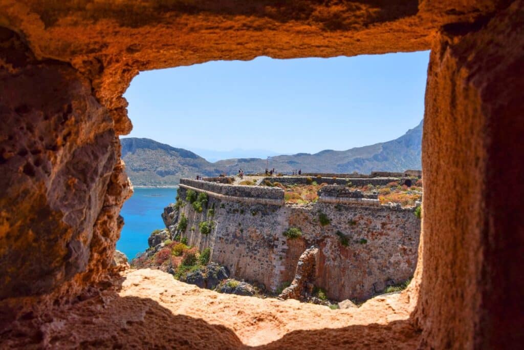 View through a square stone window of Gramvousa island crete